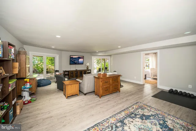 a view of a house with backyard sitting area and garden