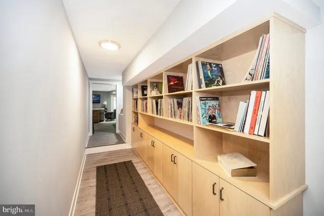 a view of a patio with table and chairs with wooden floor and fence