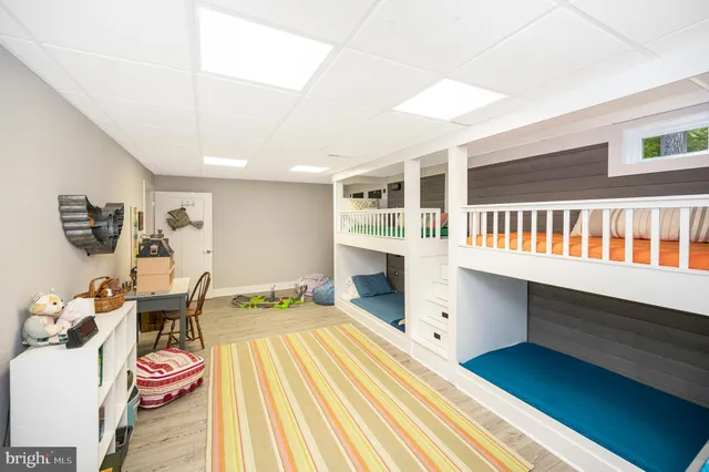 a view of a chairs and table in patio with wooden fence