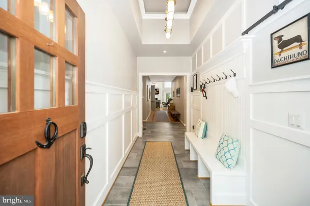 a view of an entryway with wooden floor