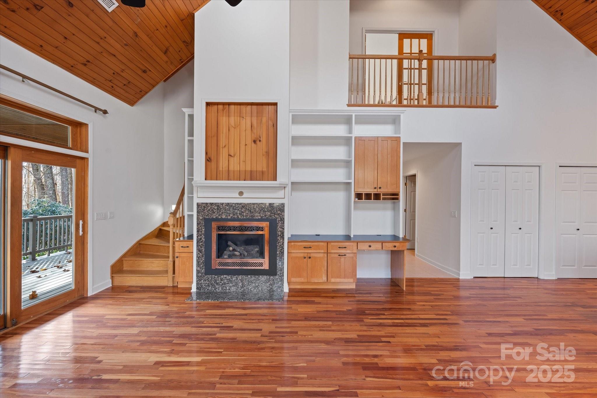 905 Old Fiddle Road Waynesville, NC 28786 - Photo 11 of 39 a view of a livingroom with an empty space and a fireplace