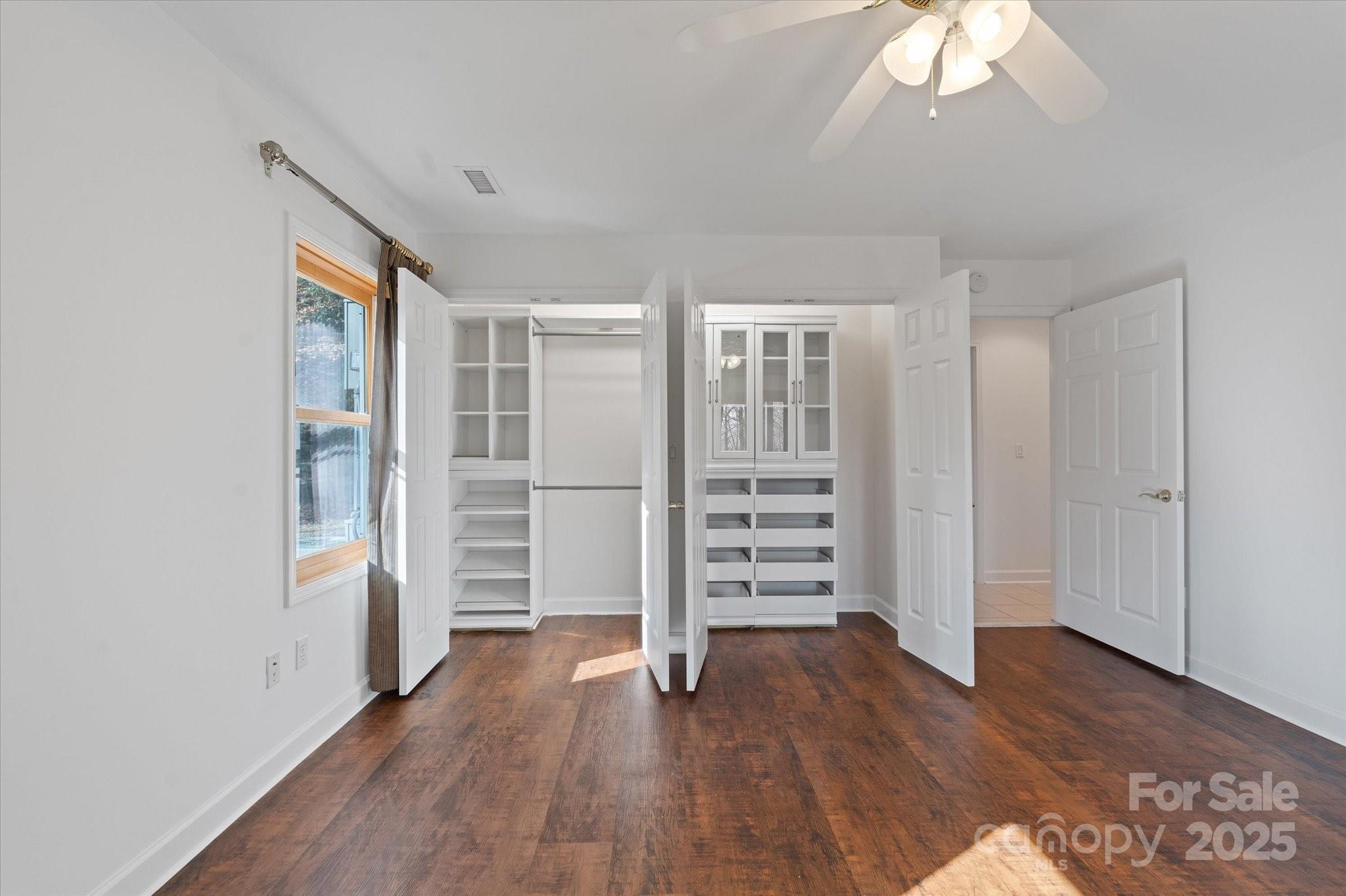 905 Old Fiddle Road Waynesville, NC 28786 - Photo 17 of 39 a view of wooden floor and windows in a room
