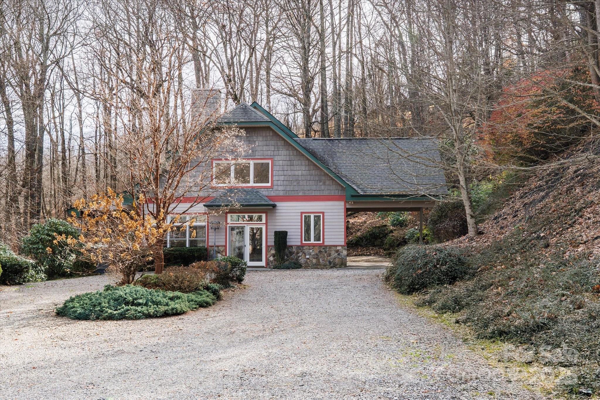 905 Old Fiddle Road Waynesville, NC 28786 - Photo 2 of 39 a view of house with a yard and large trees