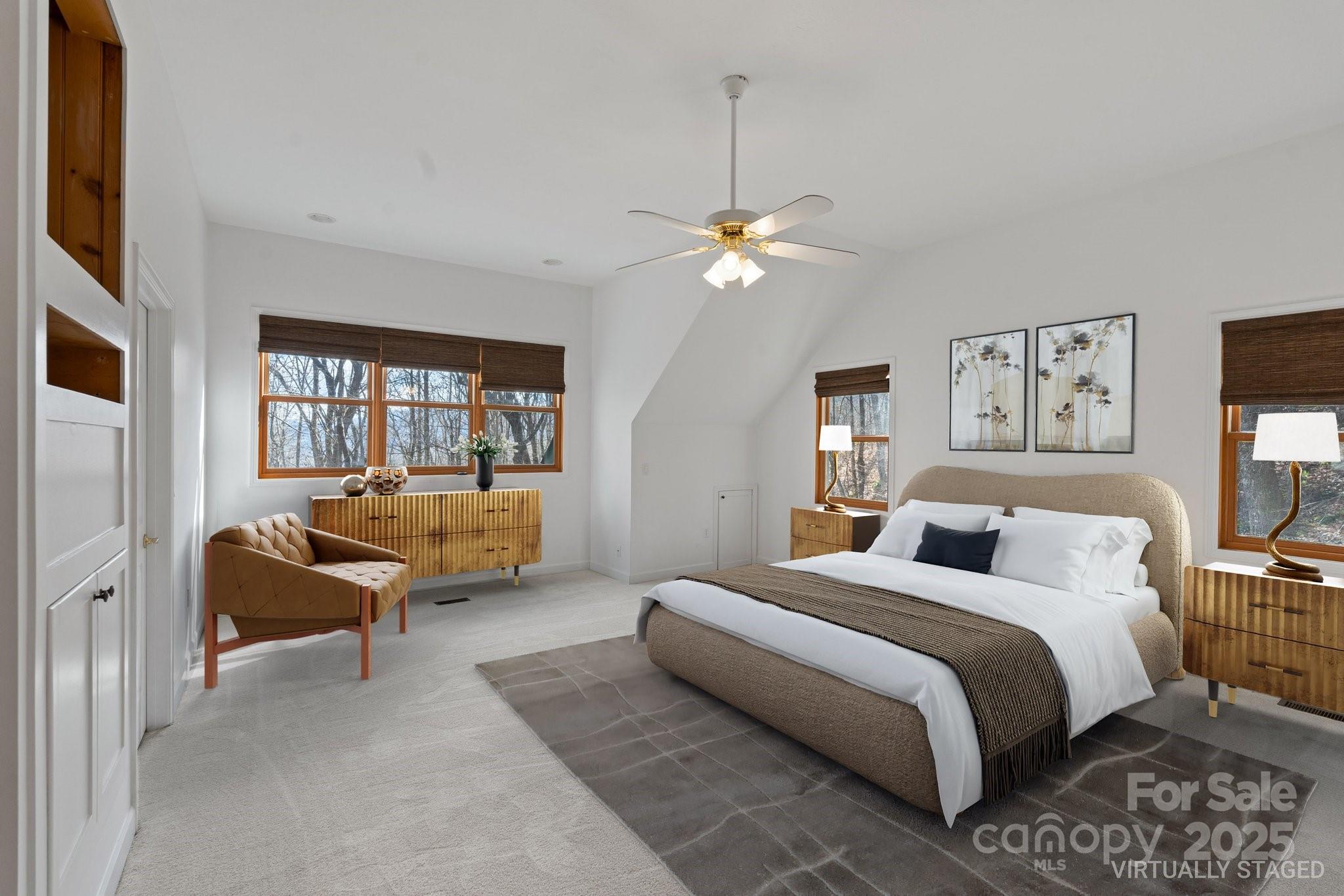 905 Old Fiddle Road Waynesville, NC 28786 - Photo 23 of 39 a bedroom with a large bed couch and a window