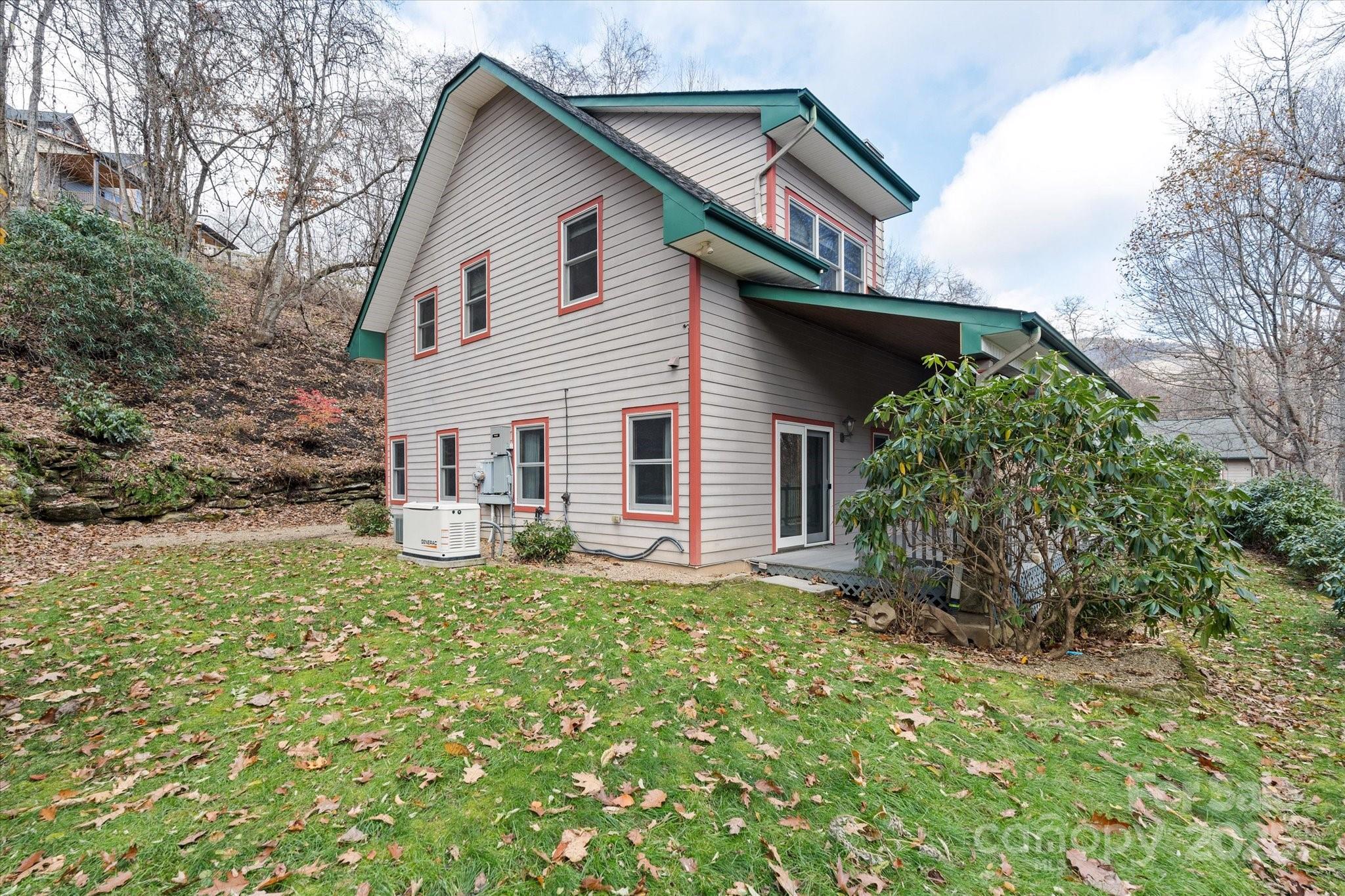 905 Old Fiddle Road Waynesville, NC 28786 - Photo 30 of 39 a view of a house with a yard