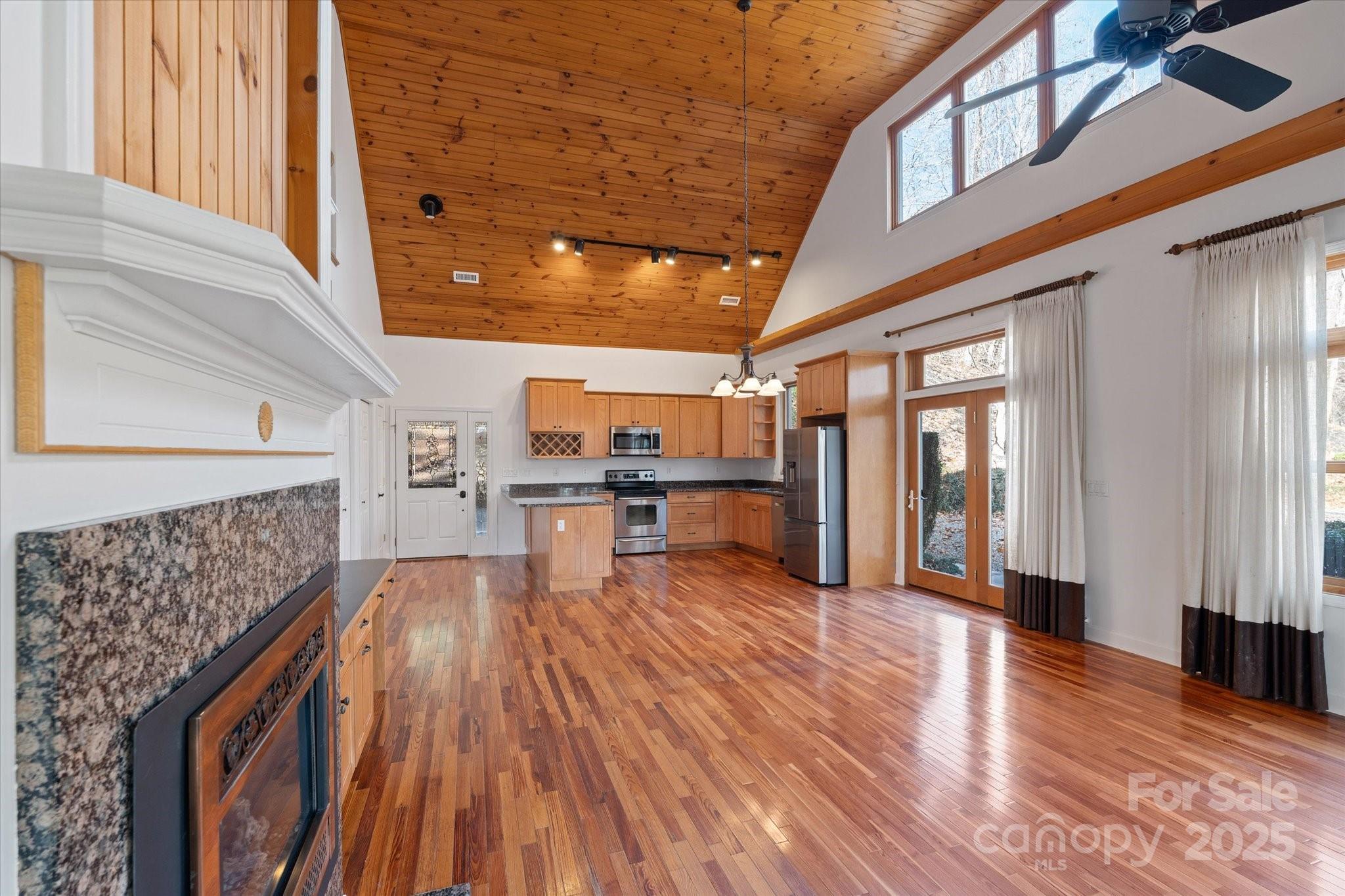 905 Old Fiddle Road Waynesville, NC 28786 - Photo 10 of 39 a view of kitchen with furniture and wooden floor