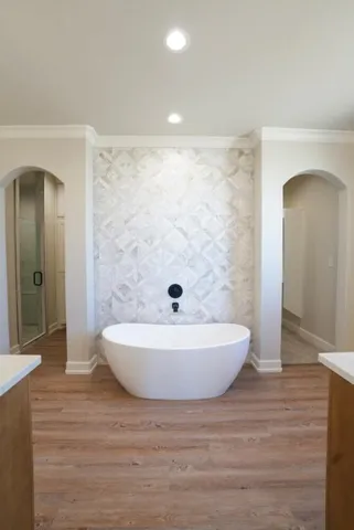 a bathroom with a bathtub and a shower