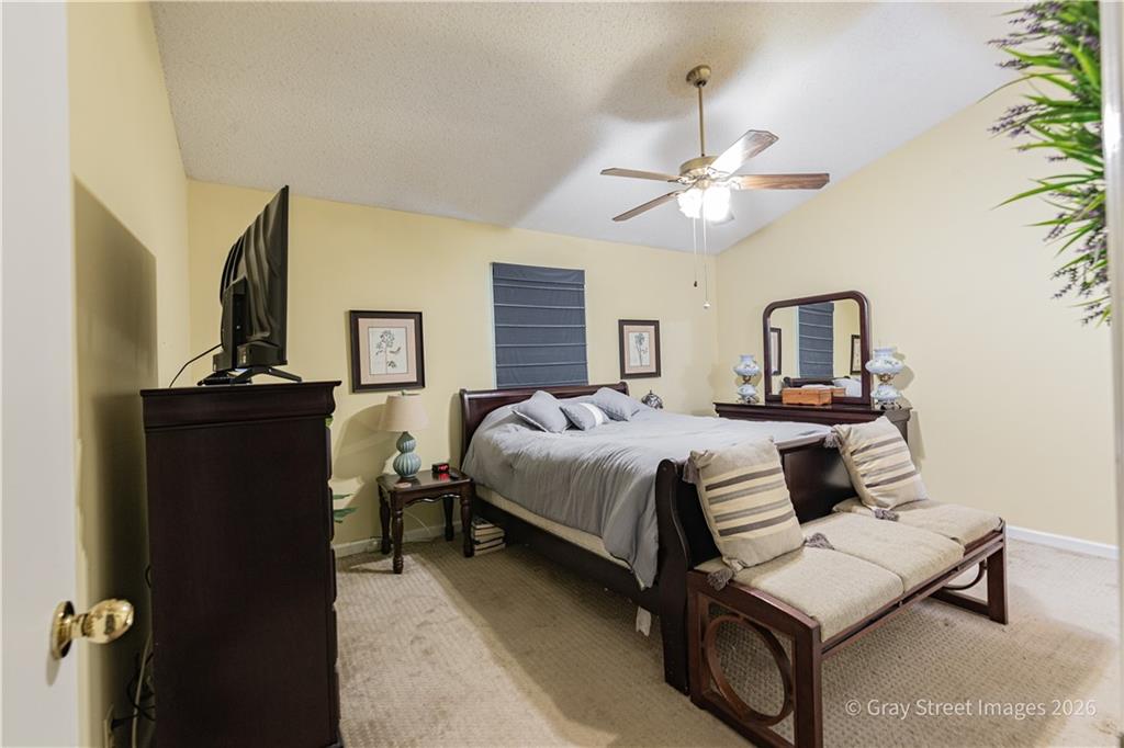 2019 Shields Road, Unit 8 Dalton, GA 30720 - Photo 12 of 17 a bedroom with a bed and a chandelier