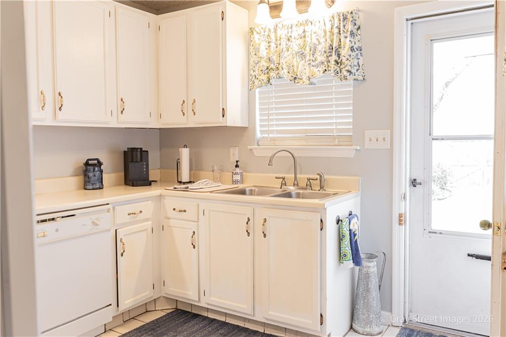 2019 Shields Road, Unit 8 Dalton, GA 30720 - Photo 15 of 17 a kitchen with white cabinets and sink