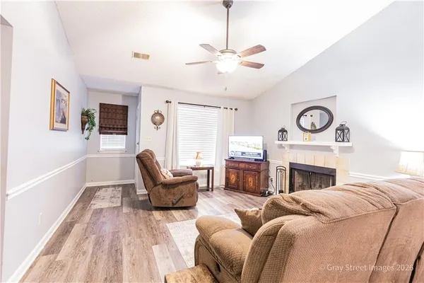 a living room with furniture and a fireplace