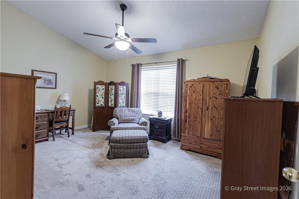 2019 Shields Road, Unit 8 Dalton, GA 30720 - Photo 4 of 17 a living room with furniture and a chandelier