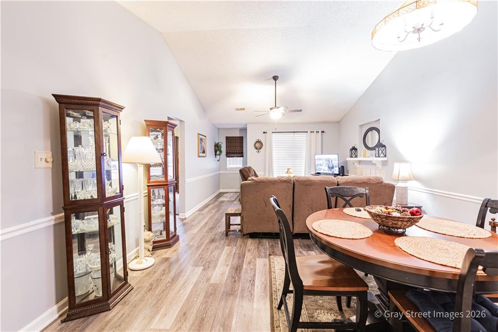 2019 Shields Road, Unit 8 Dalton, GA 30720 - Photo 9 of 17 a view of a dining room with furniture a rug and wooden floor