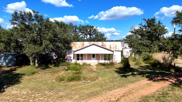 a view of a yard with swimming pool