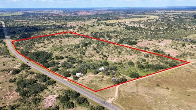 a view of a lake with houses in the background