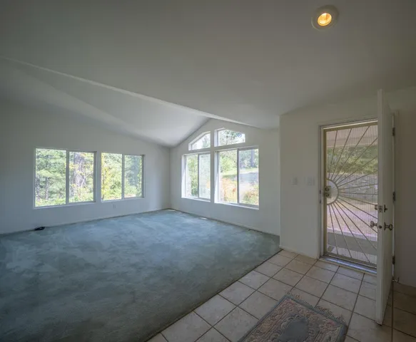 a bedroom with a bed and a night stand