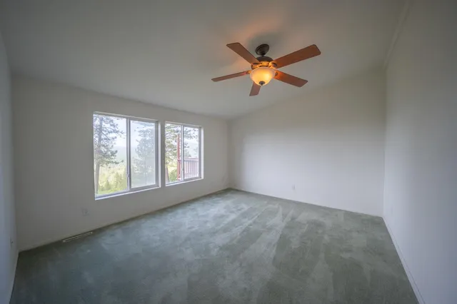 a view of balcony with deck and yard