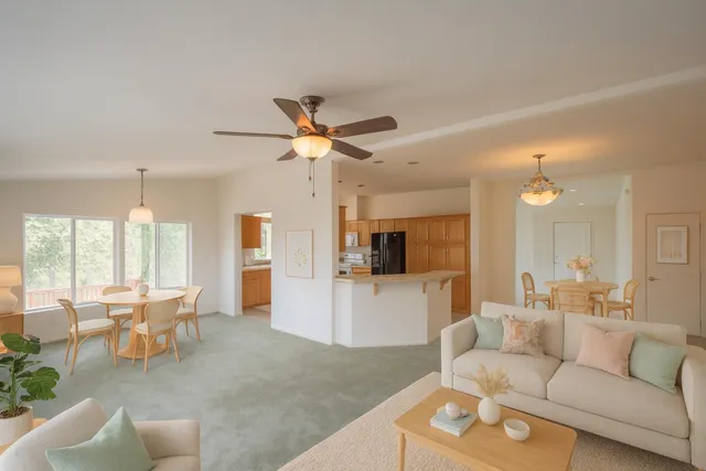 a kitchen with stainless steel appliances granite countertop a refrigerator sink and stove