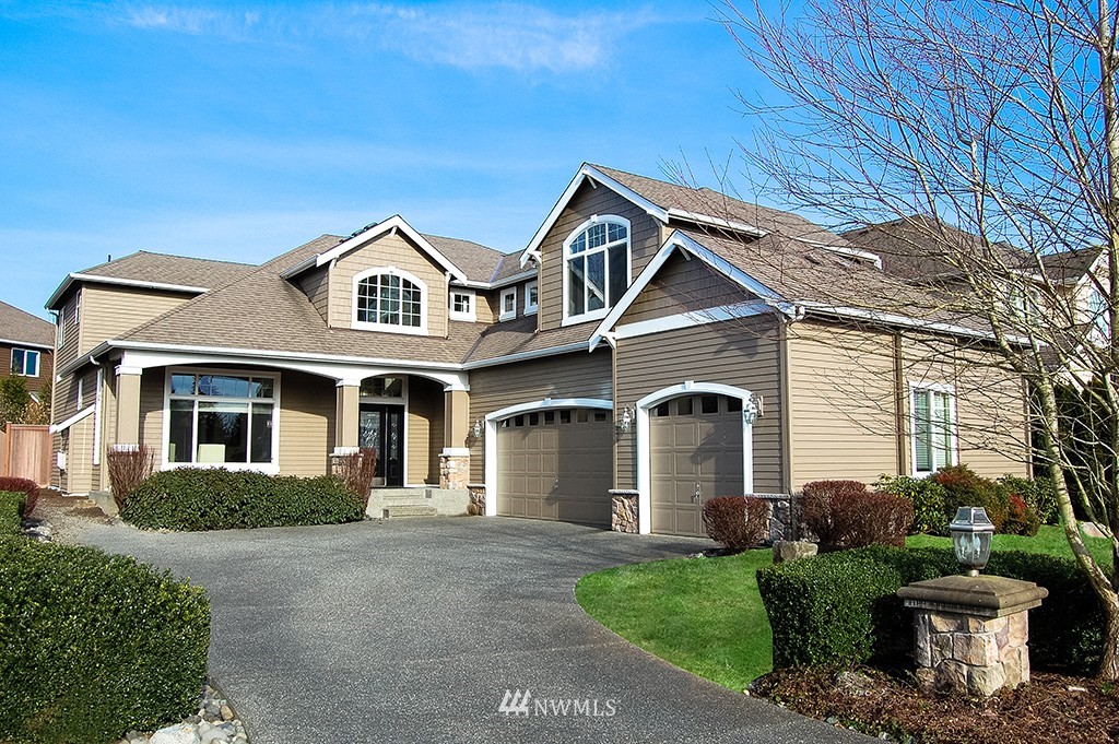 3723 207th Place Southeast Bothell, WA 98021 - Photo 1 of 15 a front view of a house with a garden