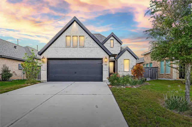 a front view of a house with yard