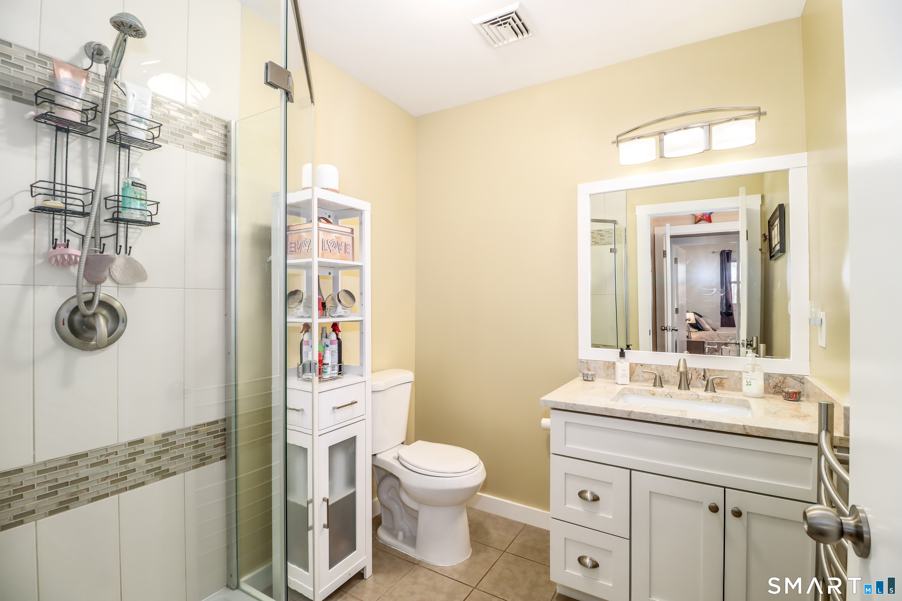 8 Marilyn Road Brookfield, CT 06804 - Photo 14 of 37 a bathroom with a granite countertop sink toilet a mirror and shower