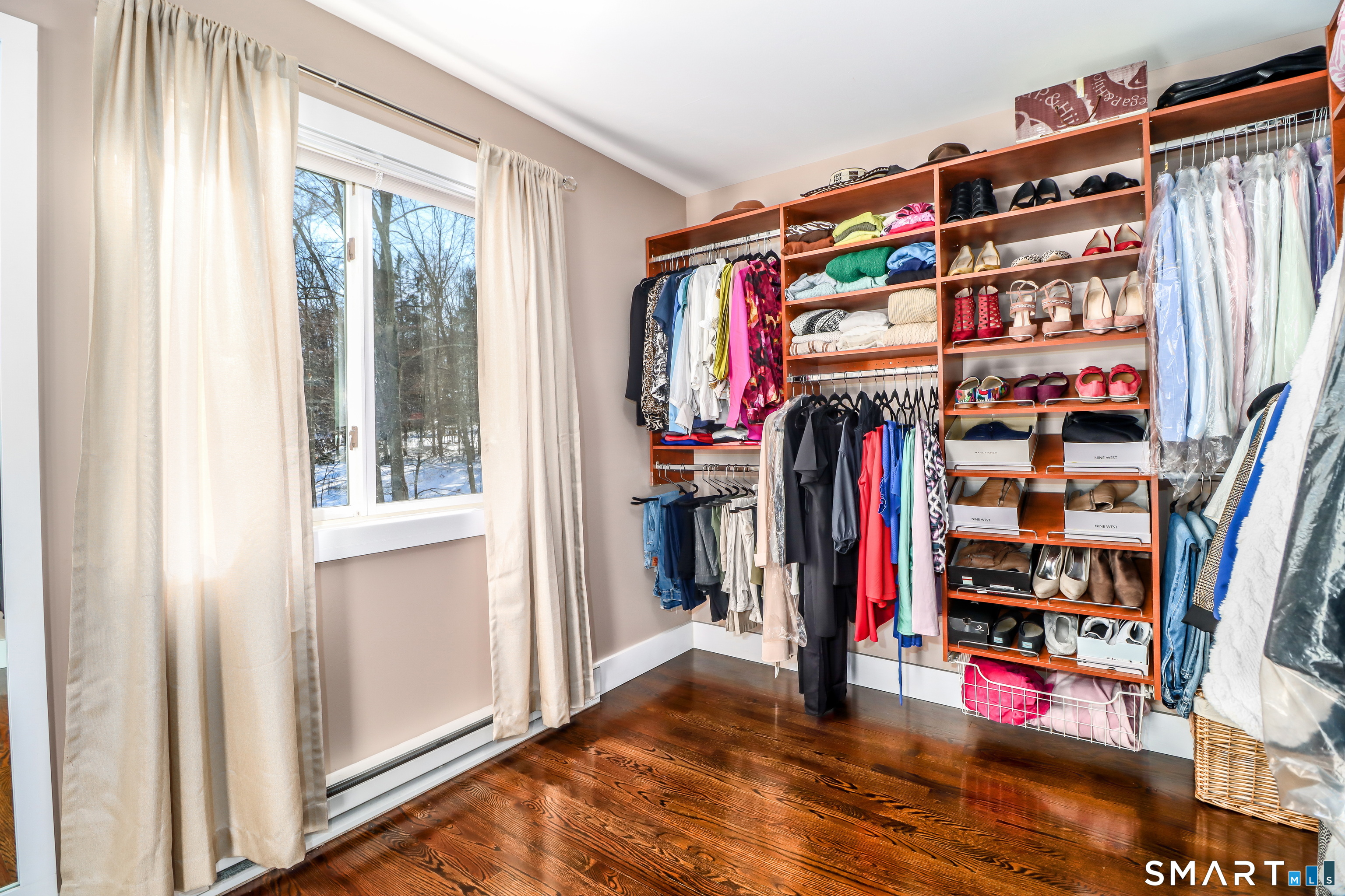 8 Marilyn Road Brookfield, CT 06804 - Photo 19 of 37 a view of walk in closet with clothes