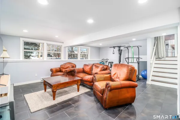 a room with gym equipment and windows