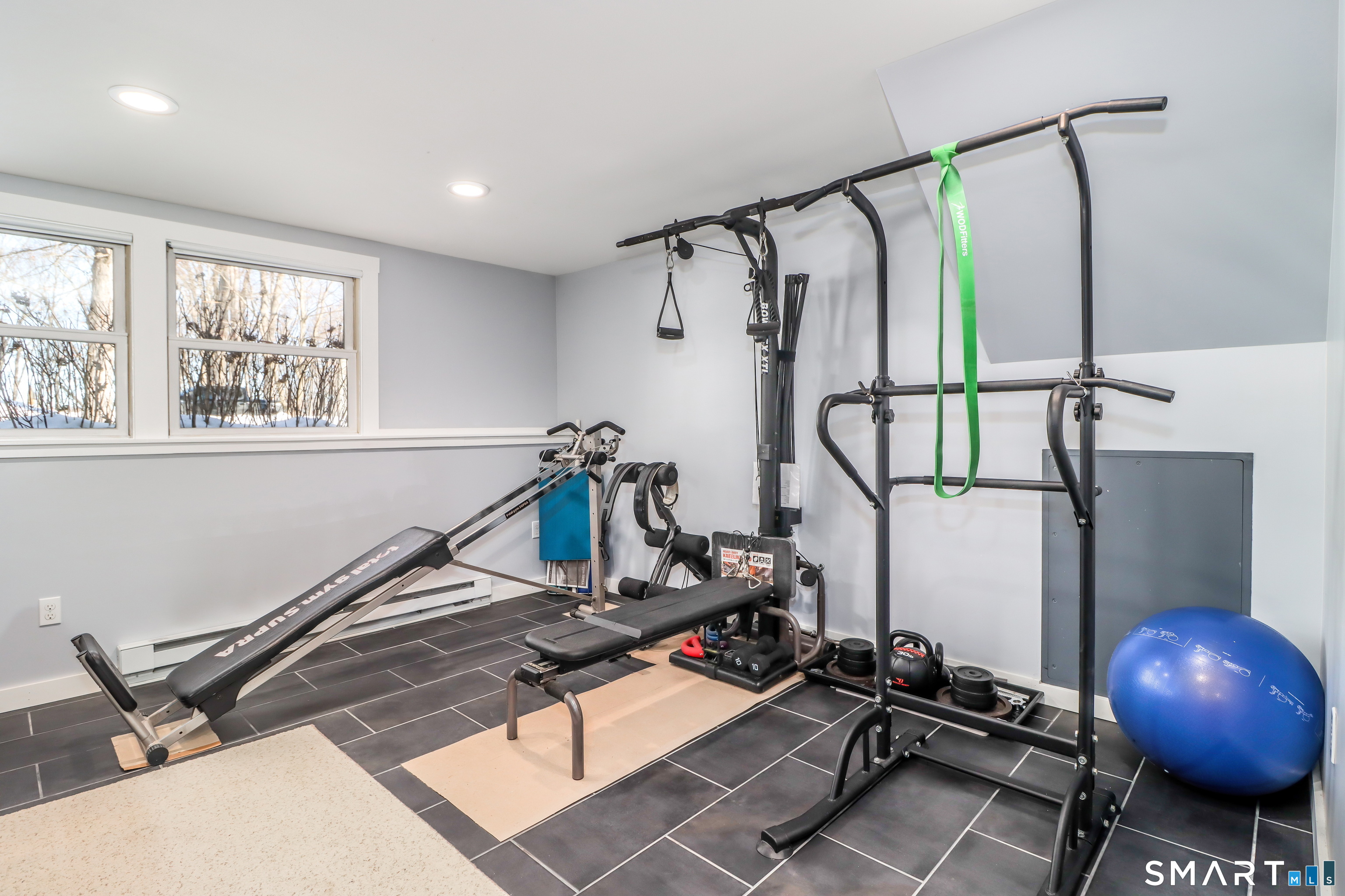 8 Marilyn Road Brookfield, CT 06804 - Photo 23 of 37 a room with gym equipment and windows