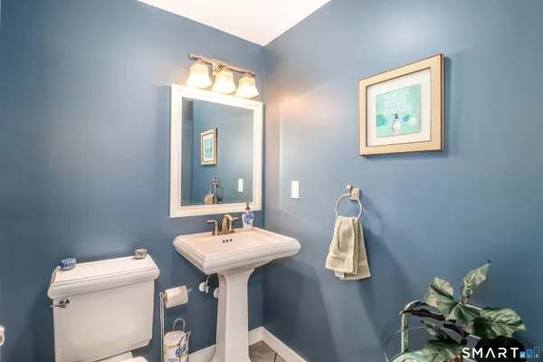a utility room with dryer washer and a view of living room