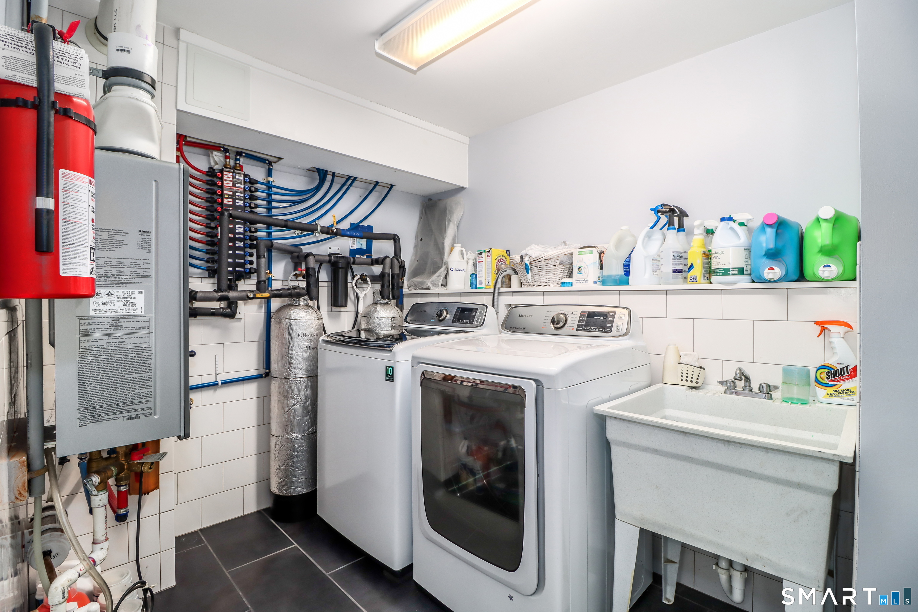 8 Marilyn Road Brookfield, CT 06804 - Photo 25 of 37 a utility room with dryer washer and a view of living room