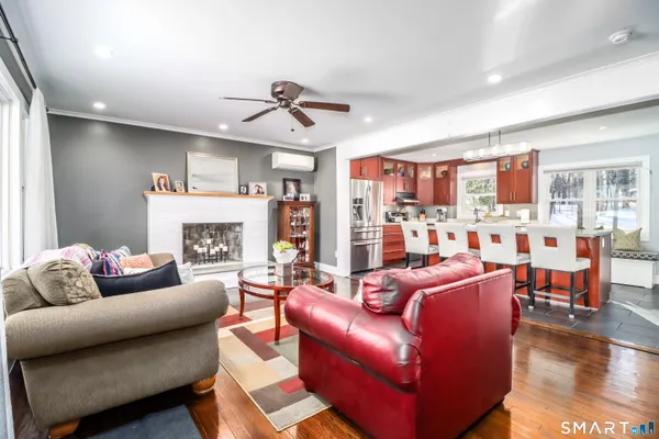 a living room with furniture and a fireplace