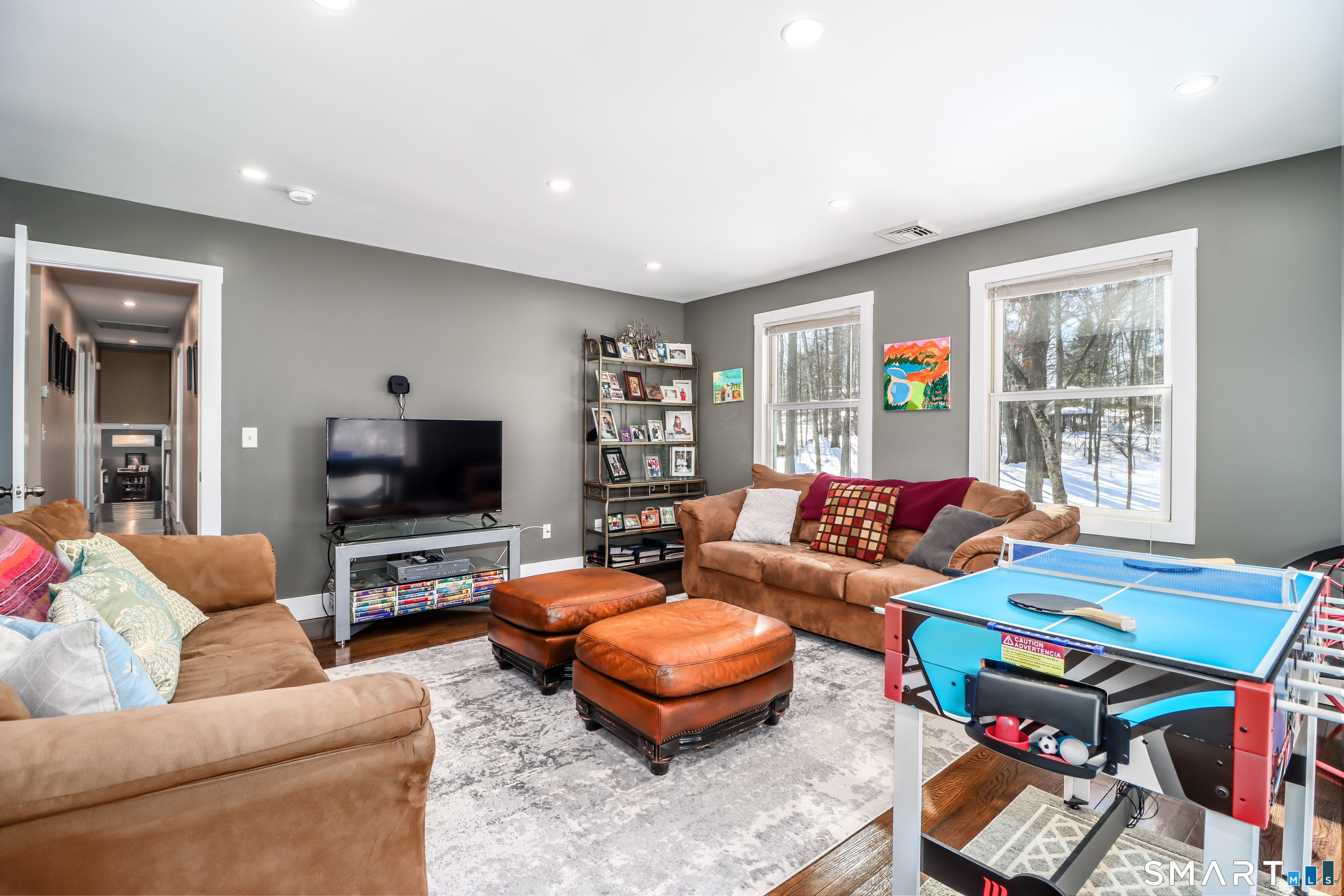8 Marilyn Road Brookfield, CT 06804 - Photo 31 of 37 a living room with furniture and a flat screen tv