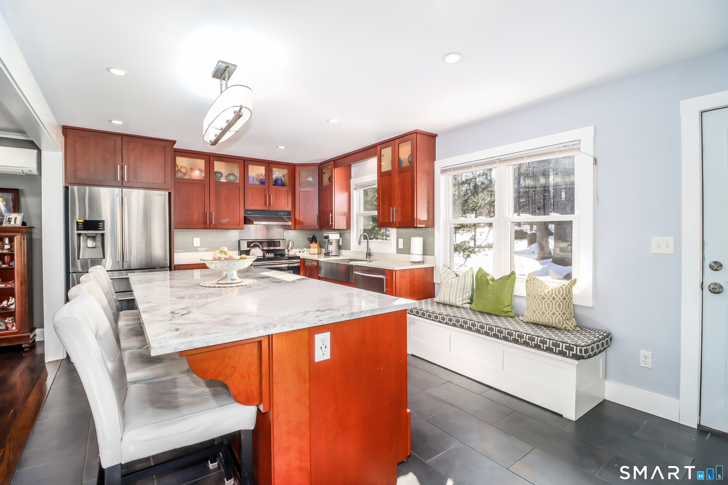 8 Marilyn Road Brookfield, CT 06804 - Photo 9 of 37 a room with stainless steel appliances kitchen island granite countertop a refrigerator a stove and a dining table with wooden floor