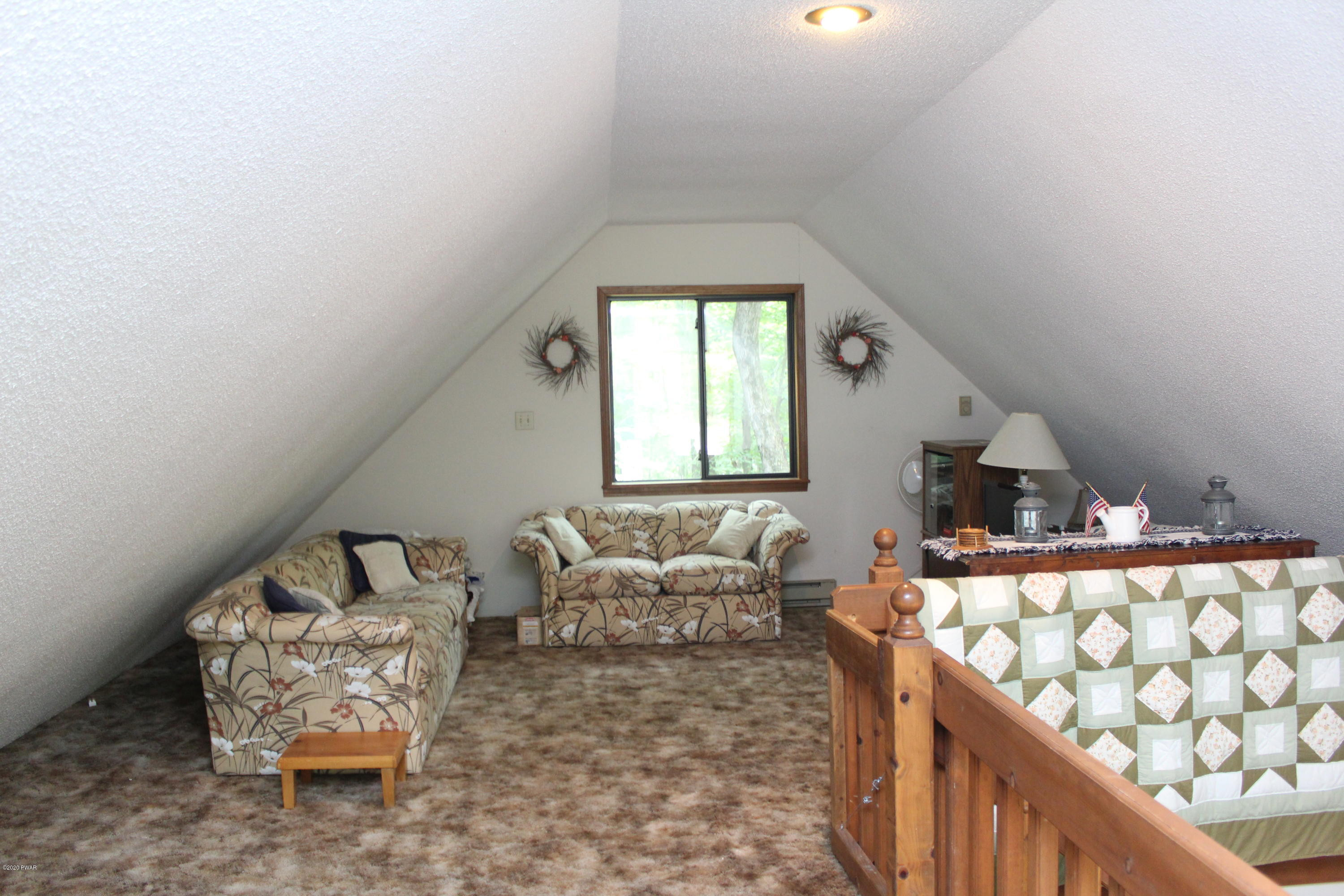382 Northgate Road Lake Ariel, PA 18436 - Photo 12 of 20 a living room with furniture and a chair