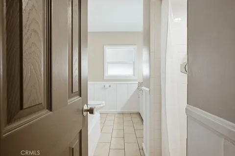 a bathroom with a shower and a sink