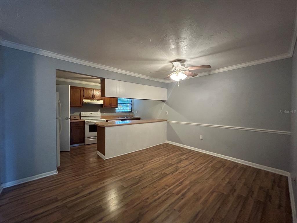 2811 Southwest Archer Road, Unit M106 Gainesville, FL 32608 - Photo 2 of 26 a view of kitchen with sink and wooden floor