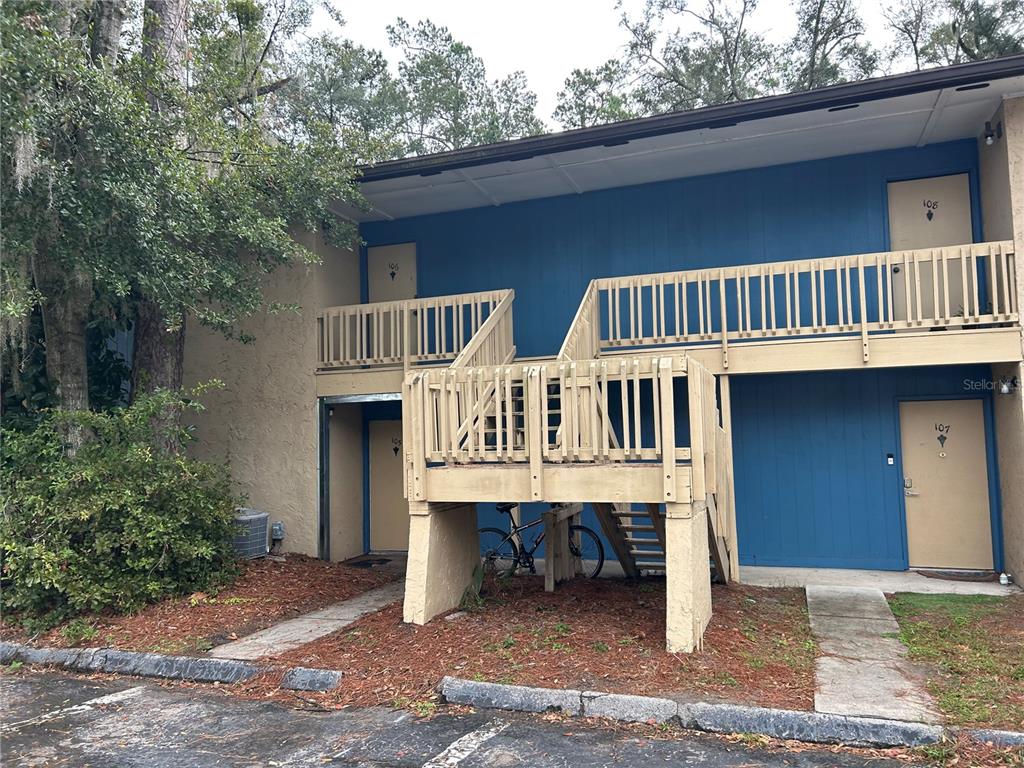 2811 Southwest Archer Road, Unit M106 Gainesville, FL 32608 - Photo 22 of 26 a front view of a house with balcony