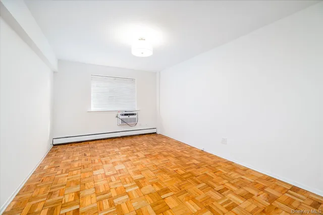 a view of a bedroom with a bed and a rug