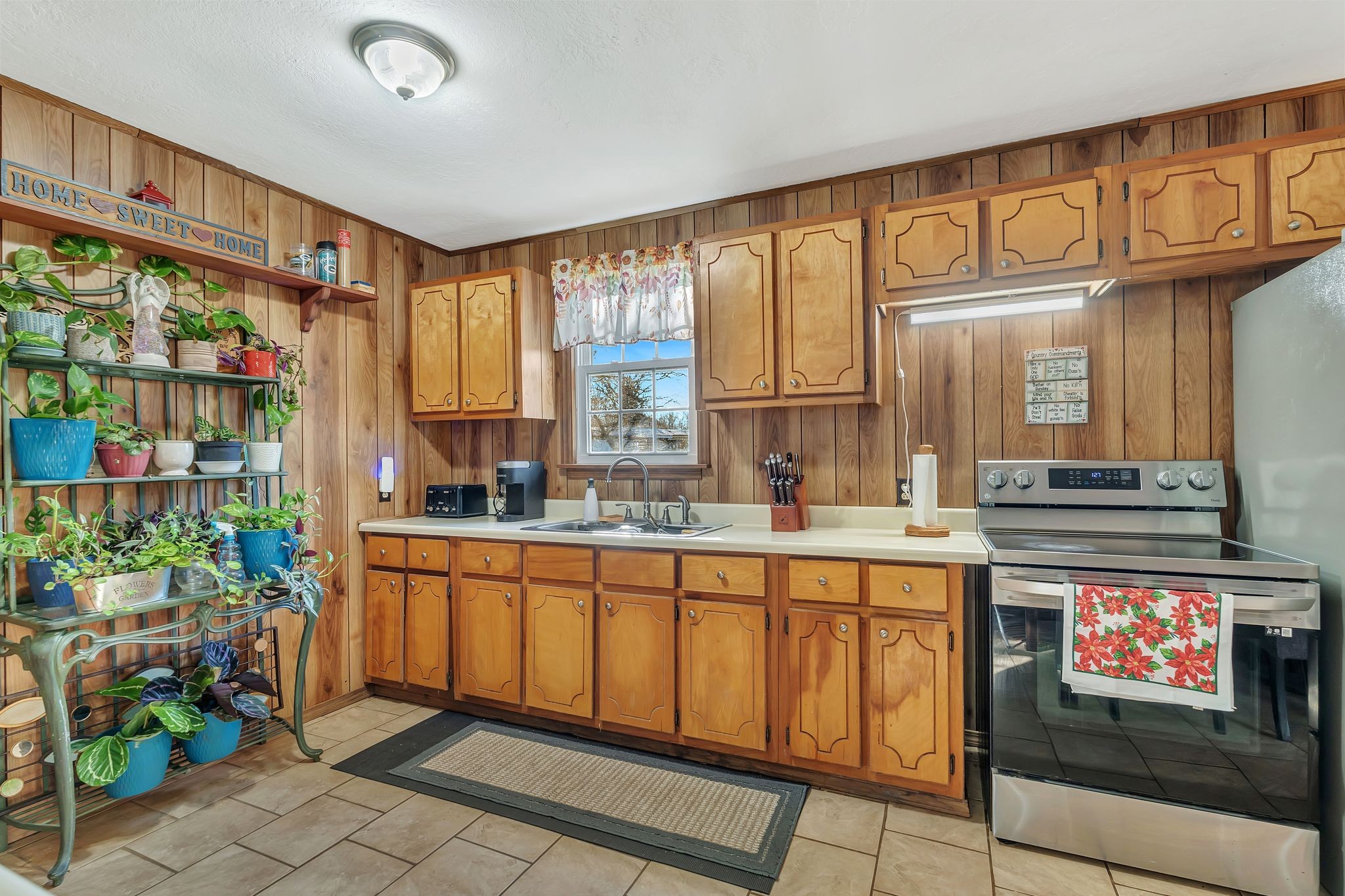 242 Union Ridge Road Wartrace, TN 37183 - Photo 13 of 33 a kitchen with stainless steel appliances granite countertop a stove a sink and a microwave