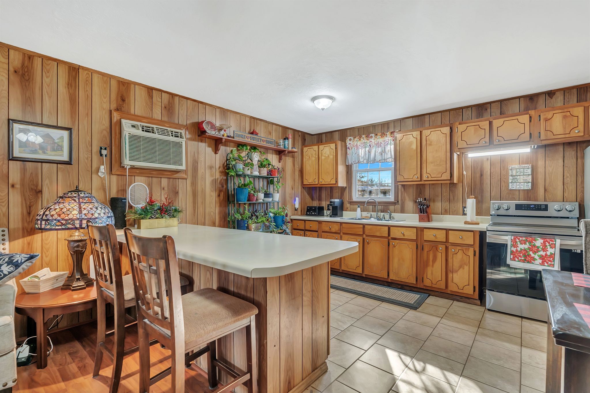 242 Union Ridge Road Wartrace, TN 37183 - Photo 14 of 33 a kitchen with stainless steel appliances granite countertop a stove top oven a sink a dining table and chairs