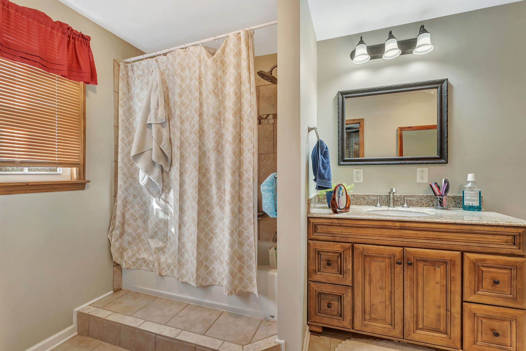 242 Union Ridge Road Wartrace, TN 37183 - Photo 19 of 33 a bathroom with a sink vanity granite tub and a mirror