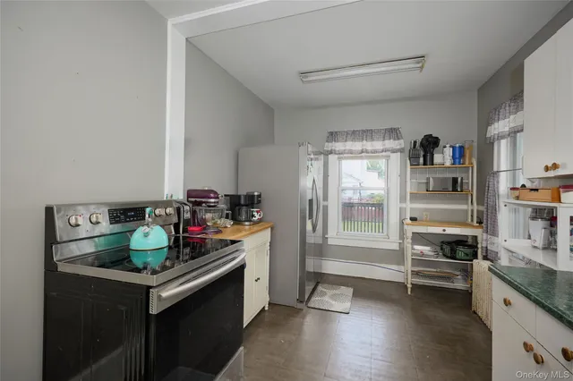 a kitchen with a stove and a refrigerator