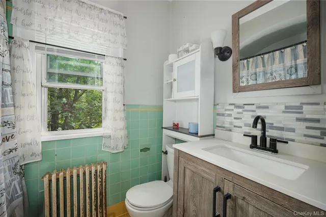 a bathroom with a sink a toilet and tub