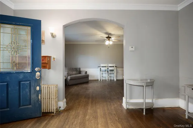 a bedroom with furniture and wooden floor