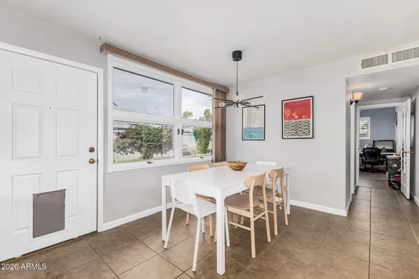 a view of a dining room with furniture