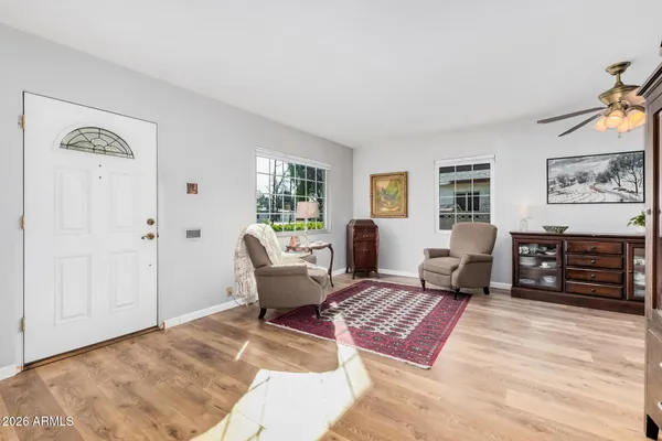 a living room with furniture rug and window