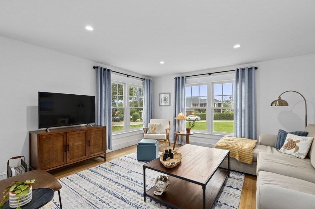 111 Mann Hill Road Scituate, MA 02066 - Photo 18 of 37 a living room with furniture and a flat screen tv