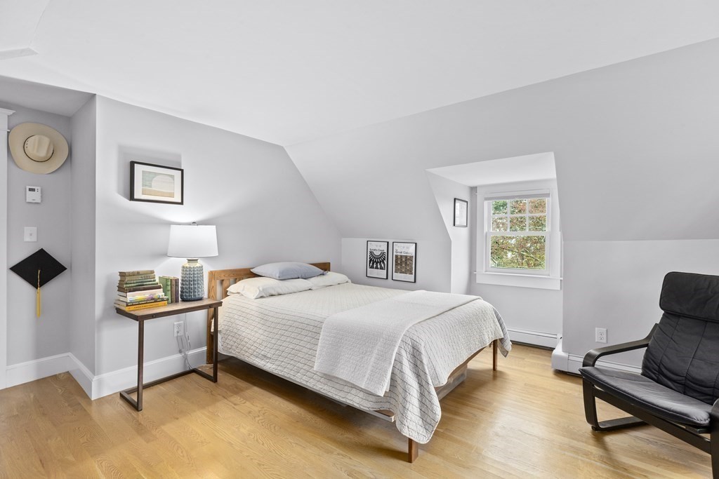 111 Mann Hill Road Scituate, MA 02066 - Photo 24 of 37 a bedroom with a bed and chair