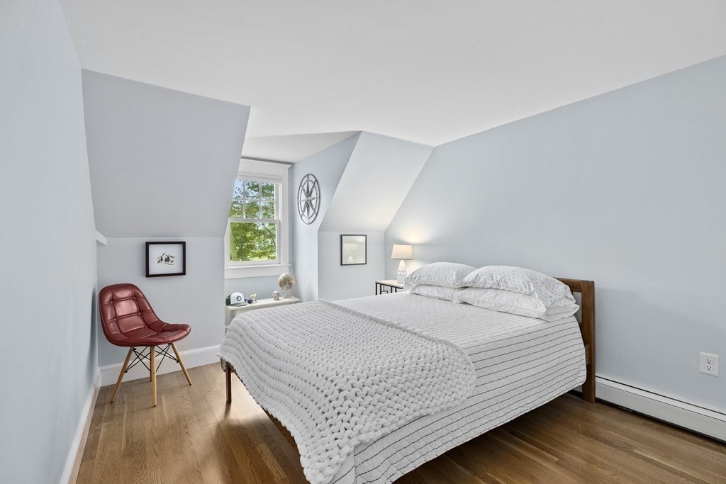 111 Mann Hill Road Scituate, MA 02066 - Photo 25 of 37 a bedroom with a bed and a chair