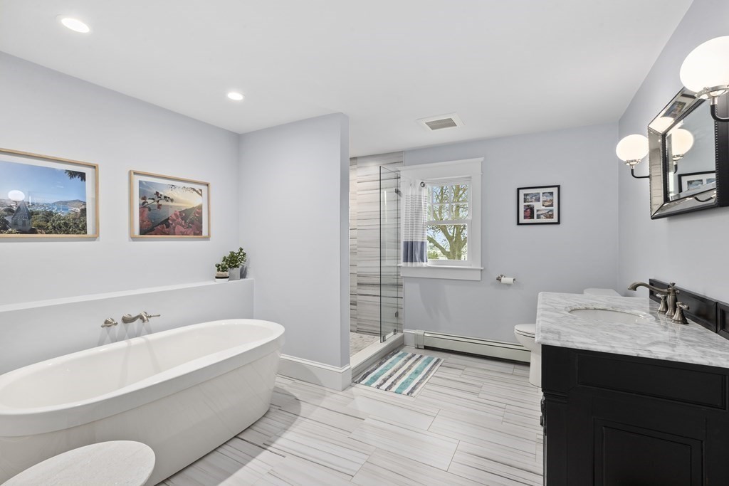 111 Mann Hill Road Scituate, MA 02066 - Photo 29 of 37 a bathroom with a tub sink and mirror