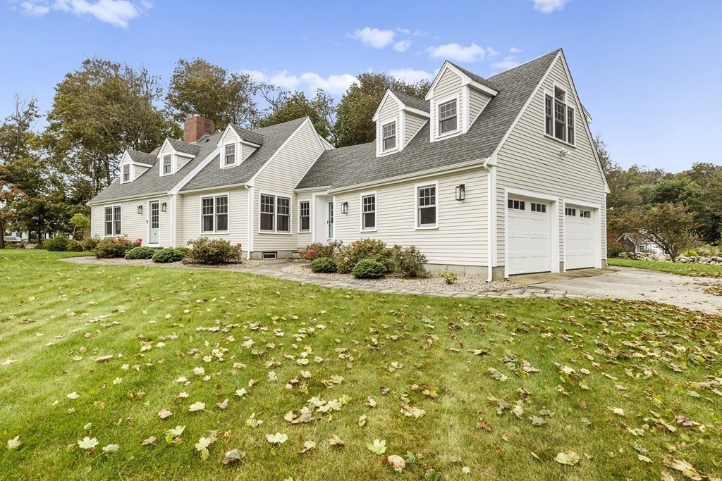 111 Mann Hill Road Scituate, MA 02066 - Photo 3 of 37 a front view of a house with a garden